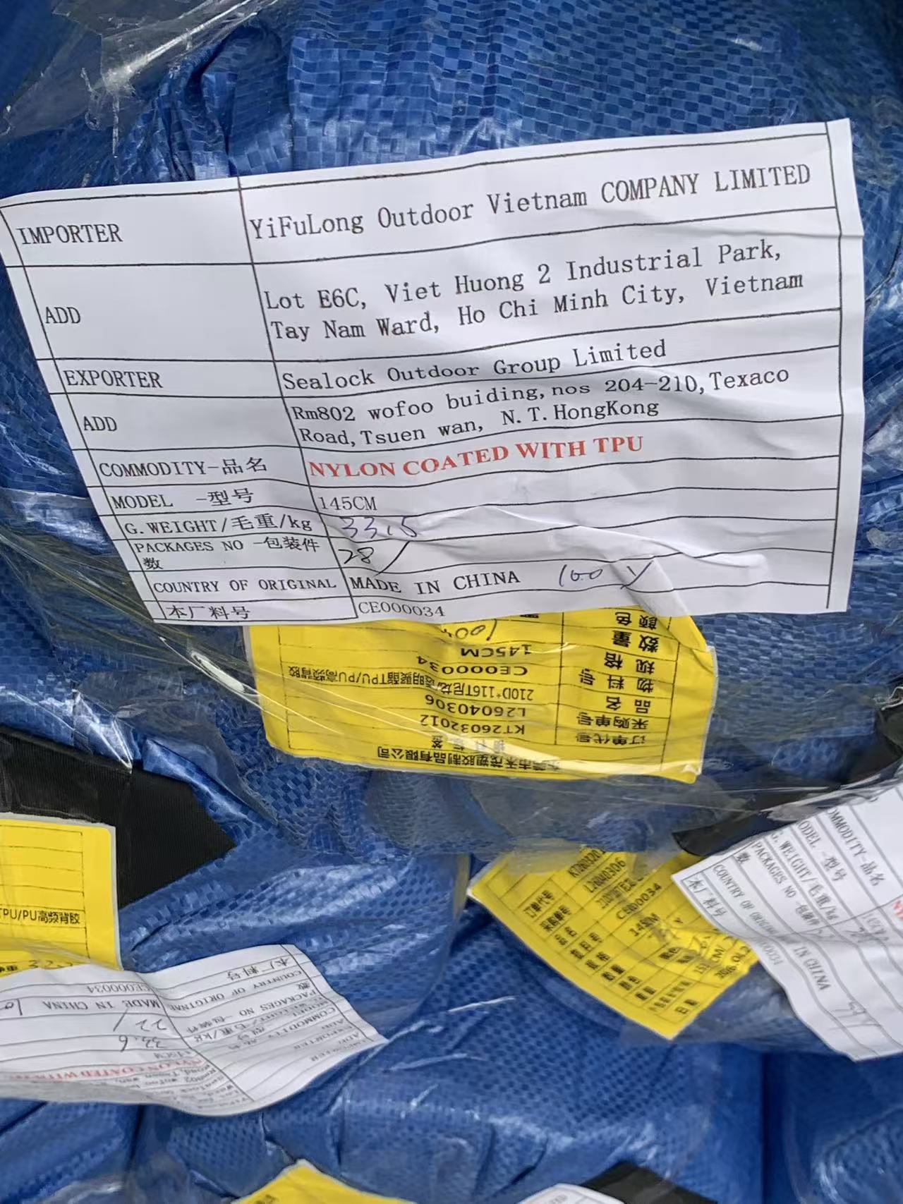 Strict QA material traceability tag on a pallet of custom ABS top covers manufactured by Anyang Plastic.