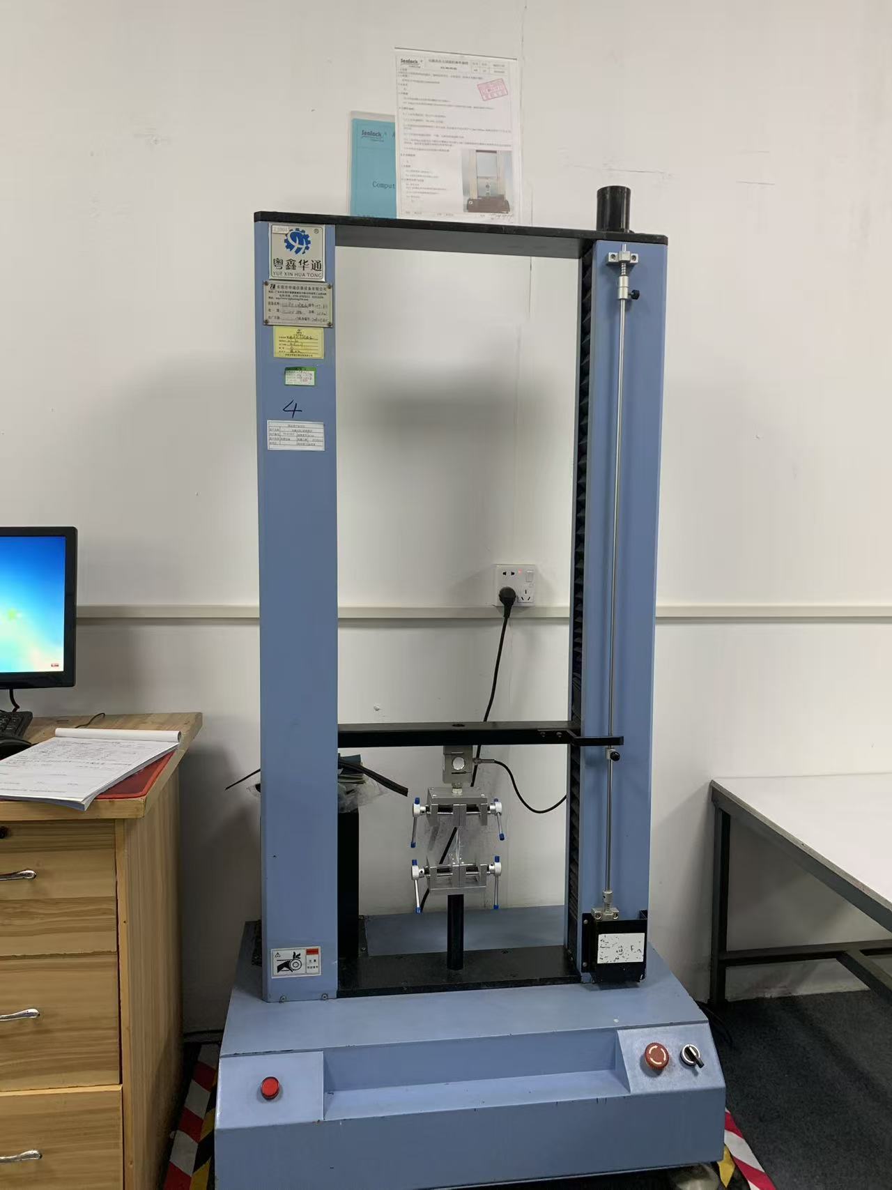 Computerized tensile and peel testing machine in the Sealock laboratory